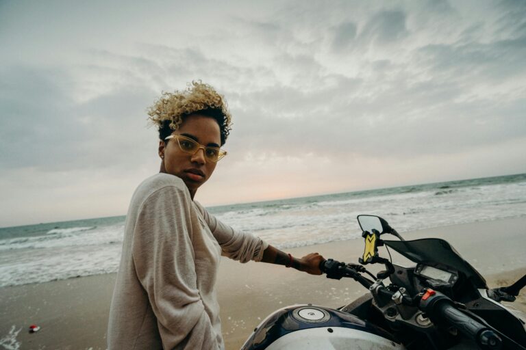 woman on motorcycle beach